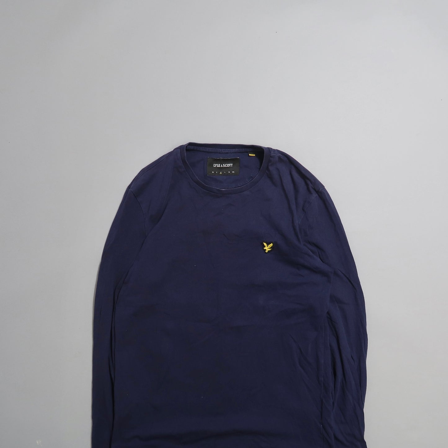 Navy blue long-sleeve shirt with yellow embroidered logo.