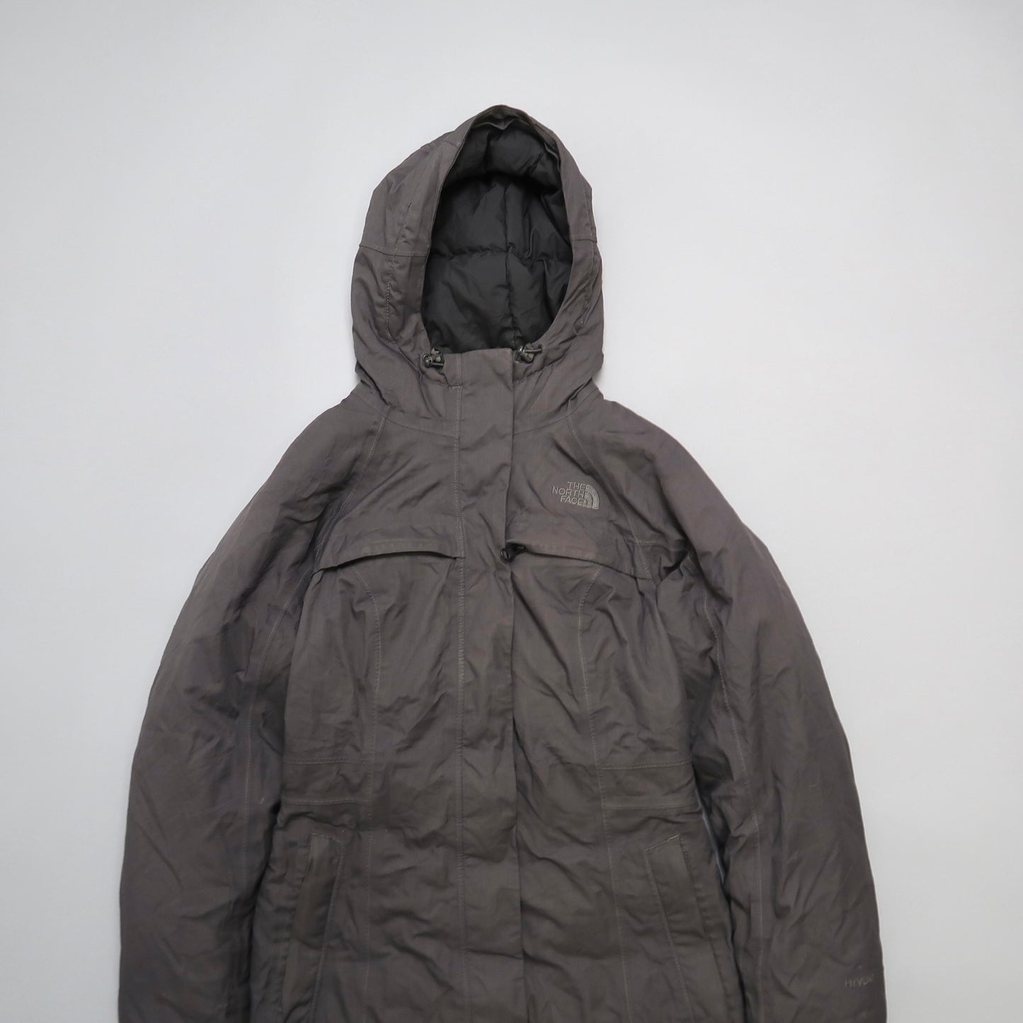 Gray hooded jacket on a plain white background.