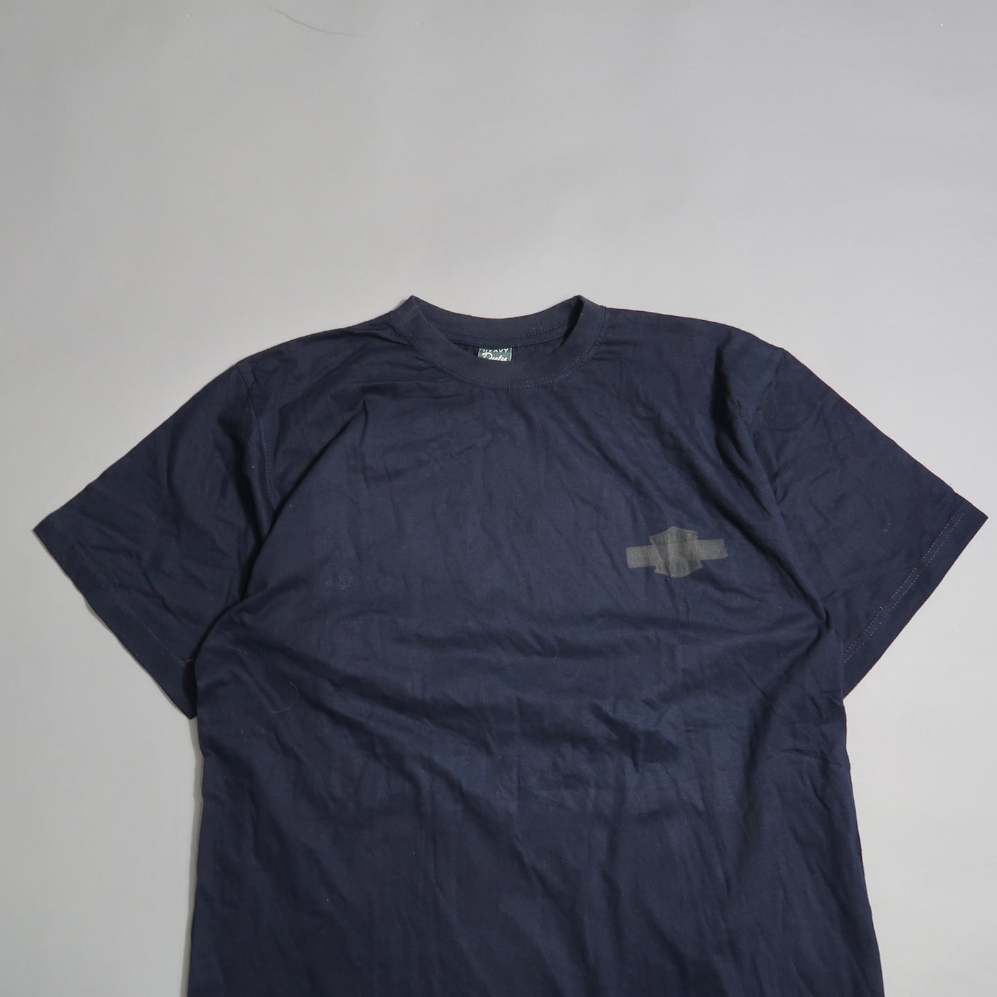 Dark blue T-shirt with a subtle logo on the chest, laid flat.