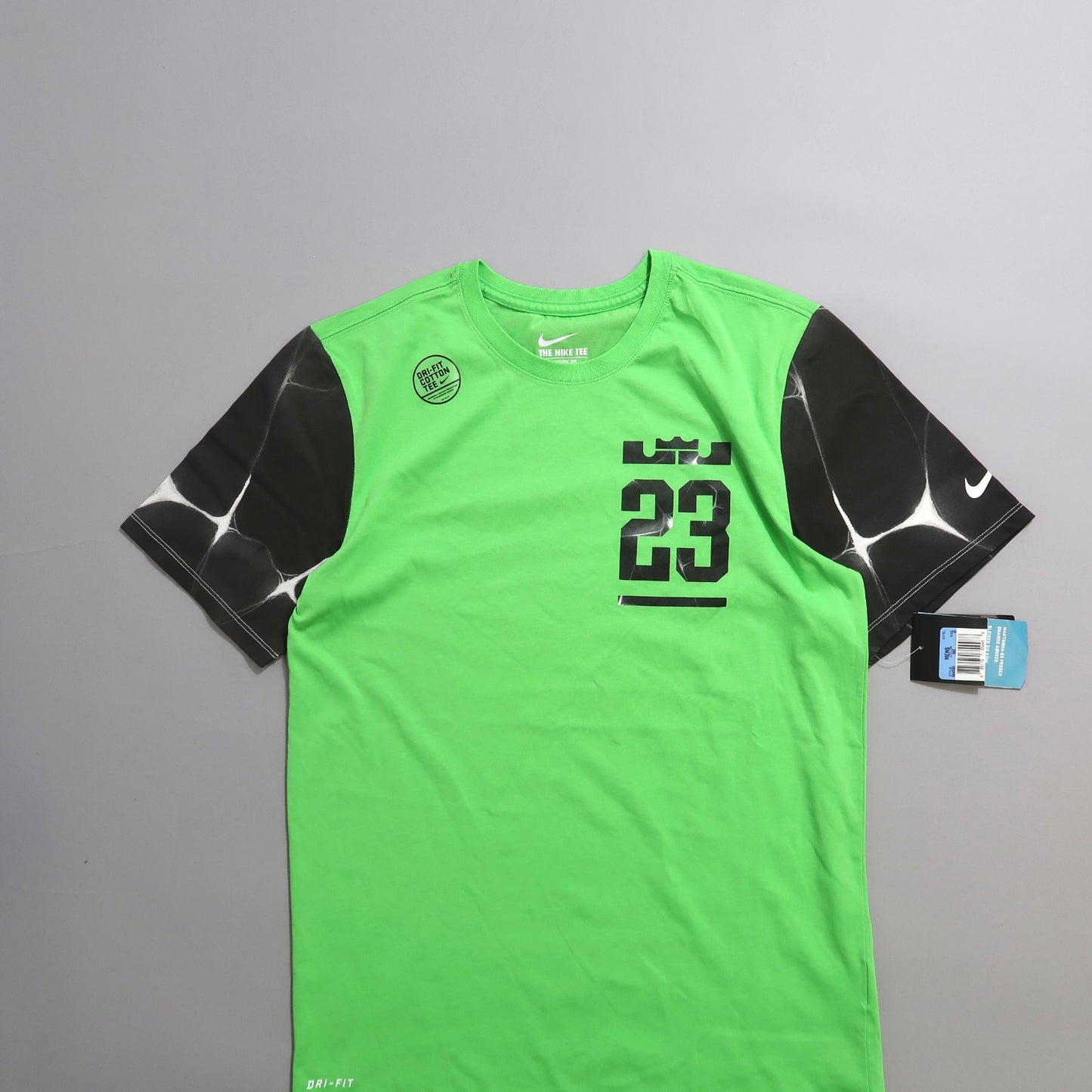 Green Nike Dri-Fit shirt with black sleeves and number 23 design.