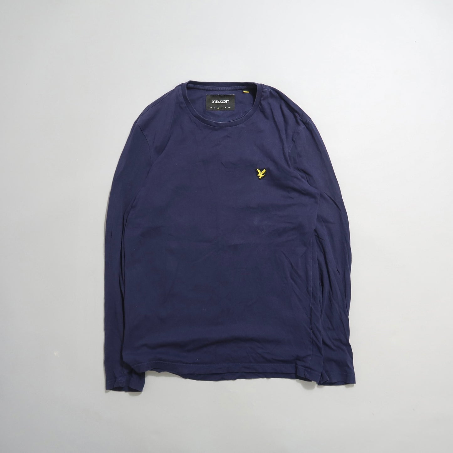 Navy long-sleeve shirt with a yellow embroidered logo.