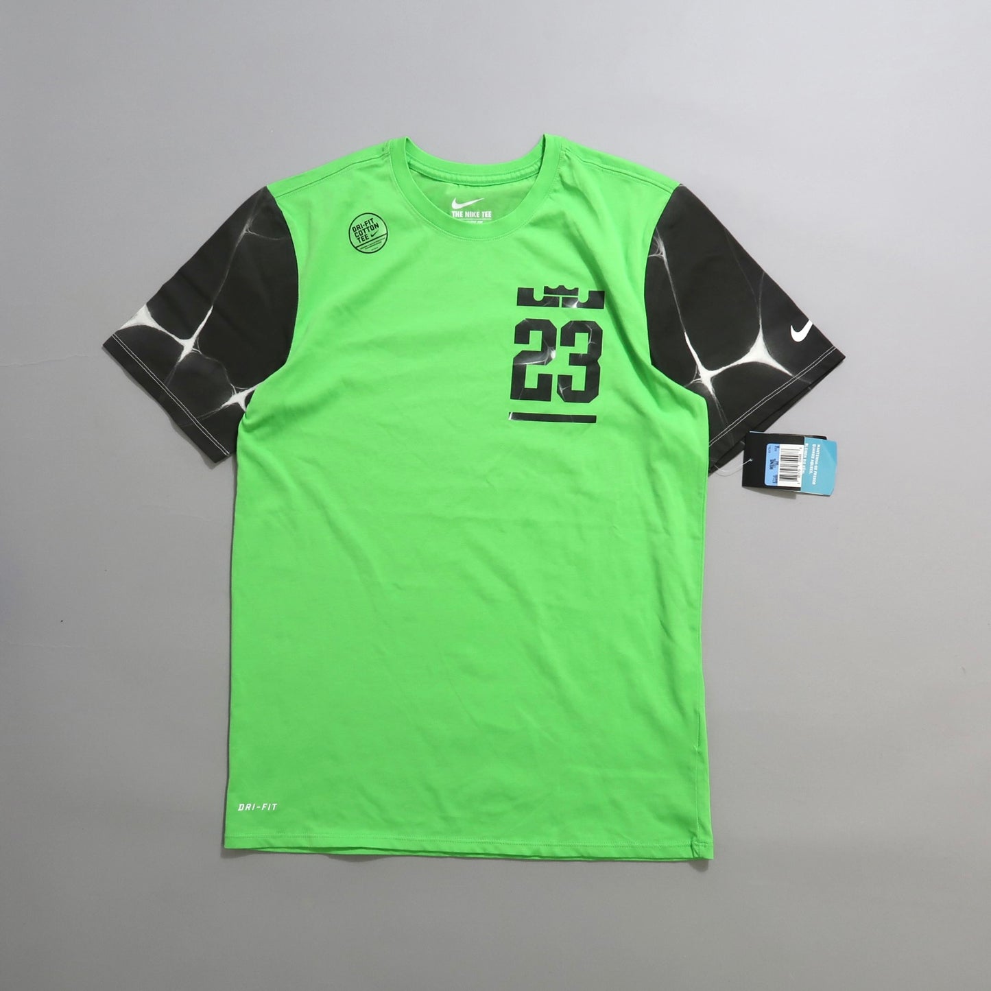 Green shirt with black sleeves, number 23 design, Nike branding.