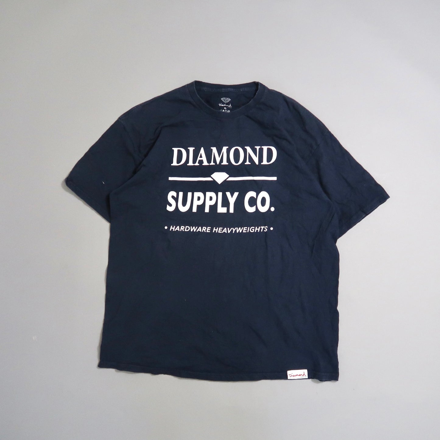Navy blue T-shirt with nullDiamond Supply Co.null printed on the front.