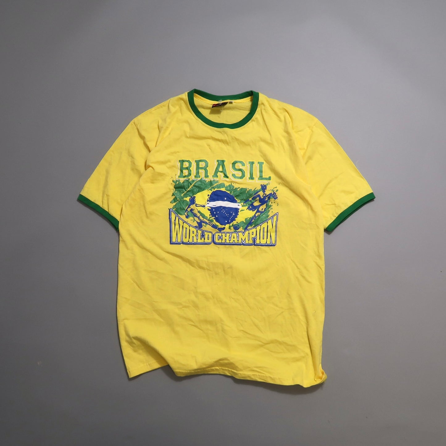 Yellow Brazil World Champion T-shirt with green accents.