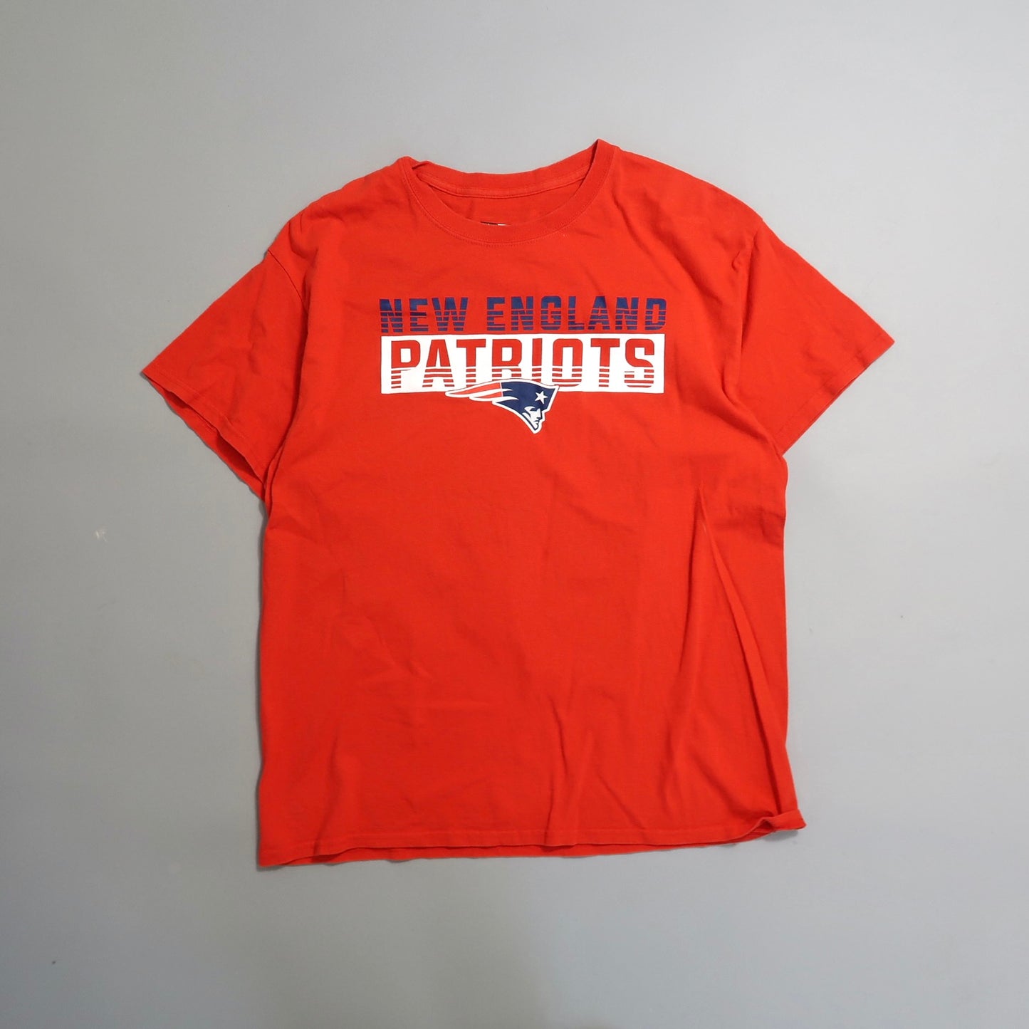 Red T-shirt with nullNew England Patriotsnull and team logo on chest.