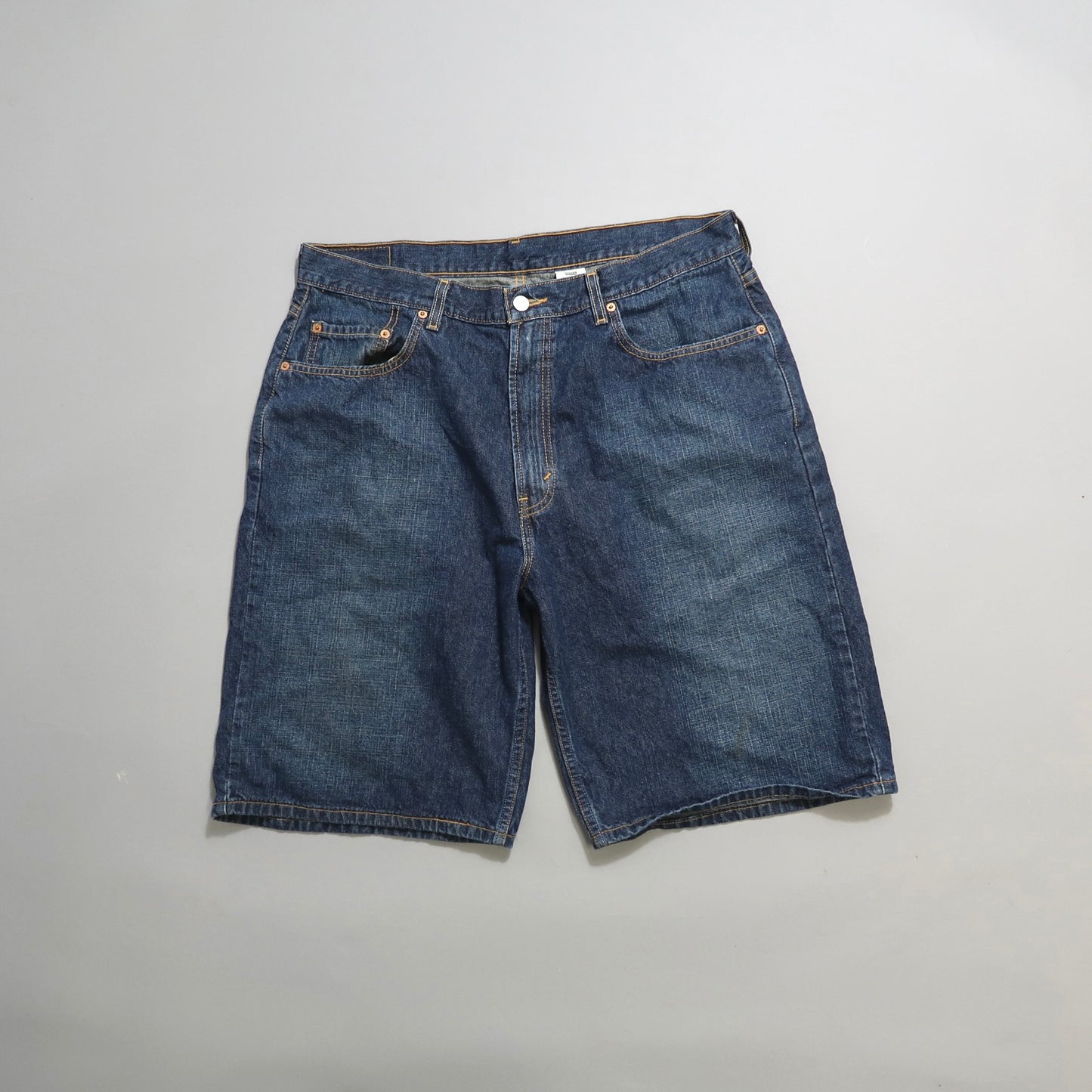 Blue denim shorts on a neutral background.