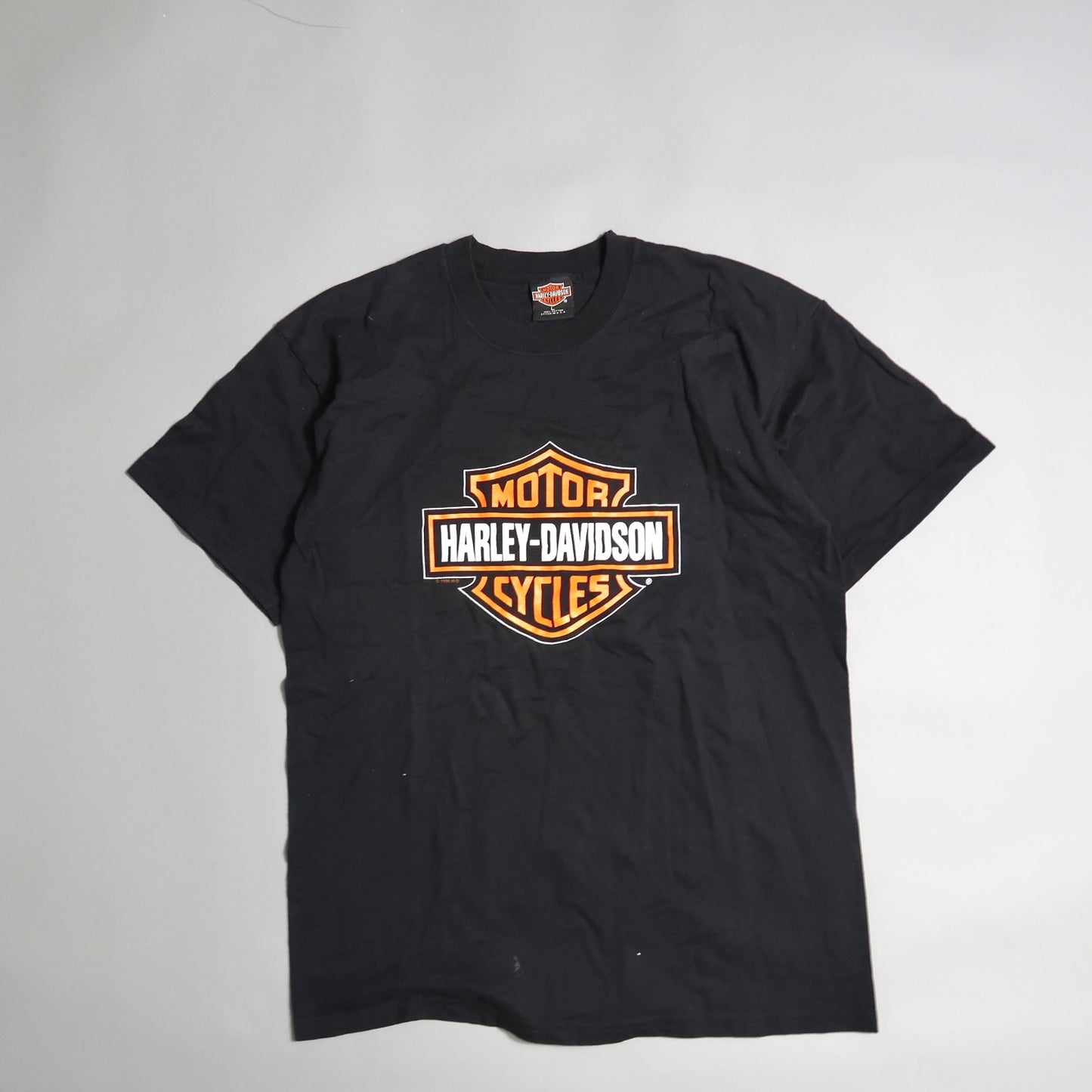 Black T-shirt with Harley-Davidson logo on the front.