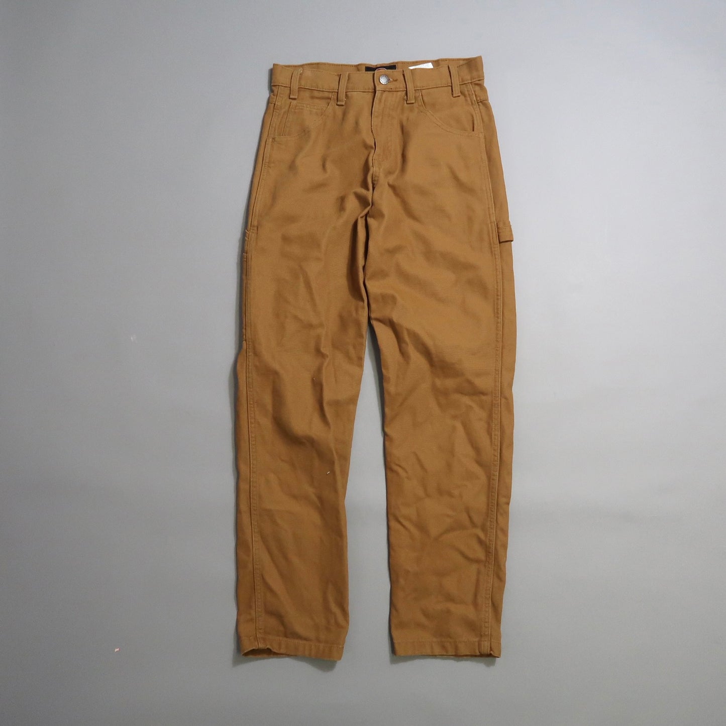 Brown work pants on a gray background.