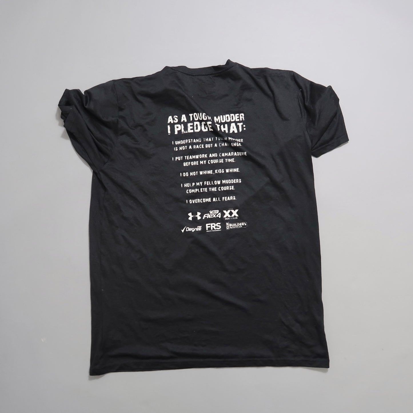 Black T-shirt with a printed Tough Mudder pledge on the back.