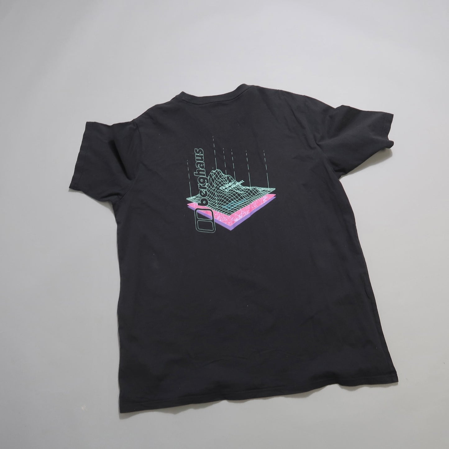 Black t-shirt with neon wireframe graphic and text on the back.