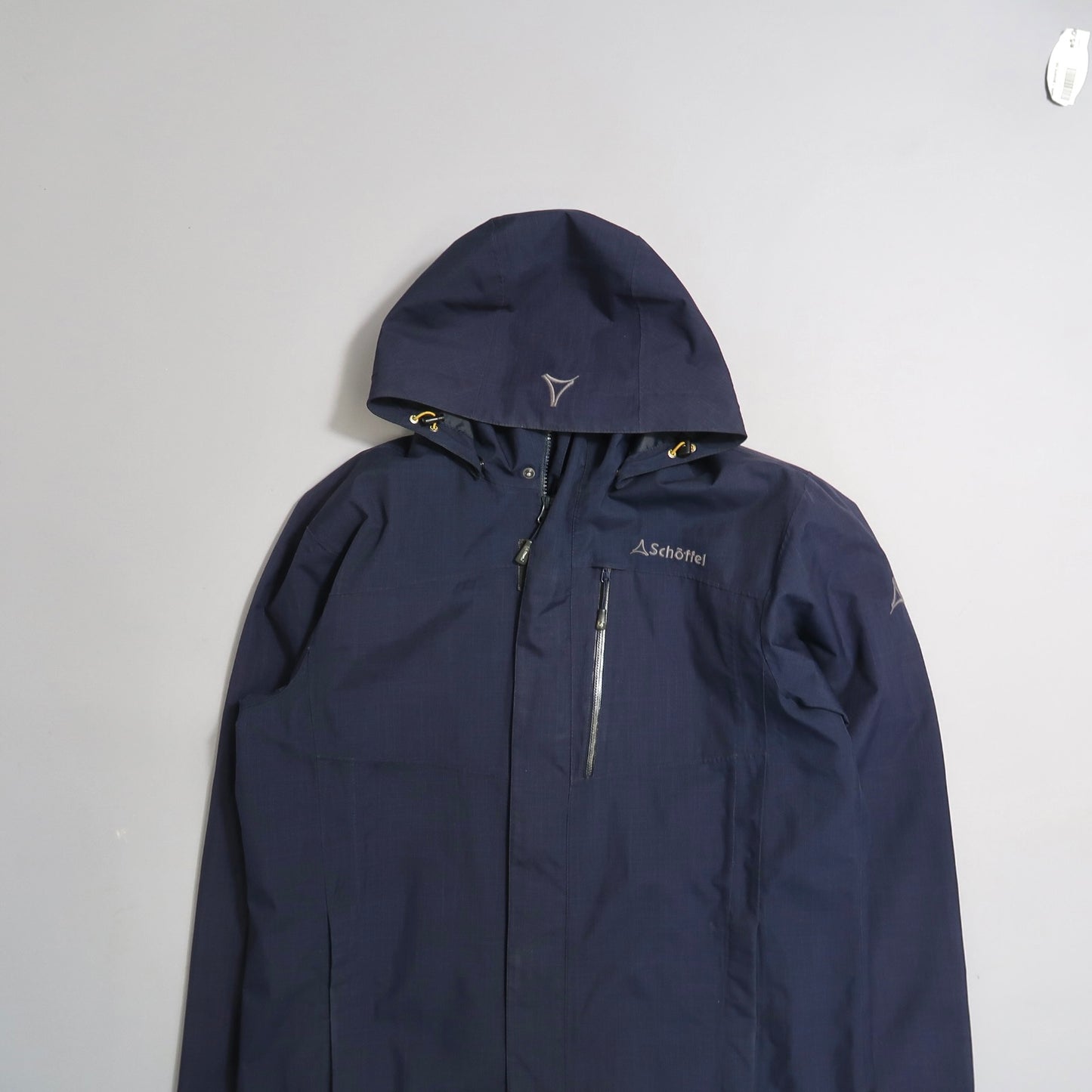 Dark blue hooded jacket with Schöffel logo on the chest.