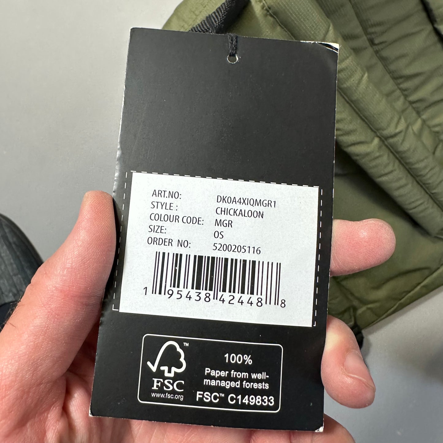 Clothing tag with product details and FSC certification logo.