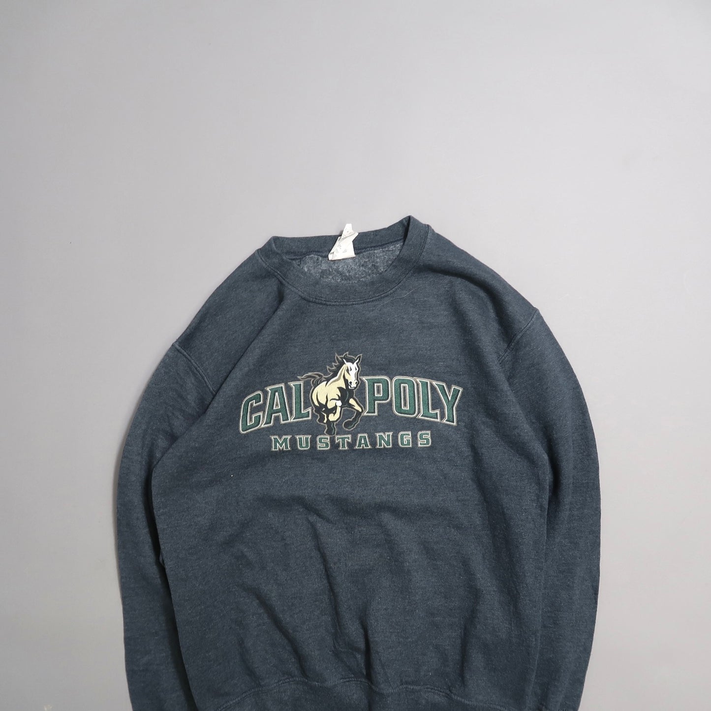 Gray sweatshirt with nullCal Poly Mustangsnull and horse graphic.