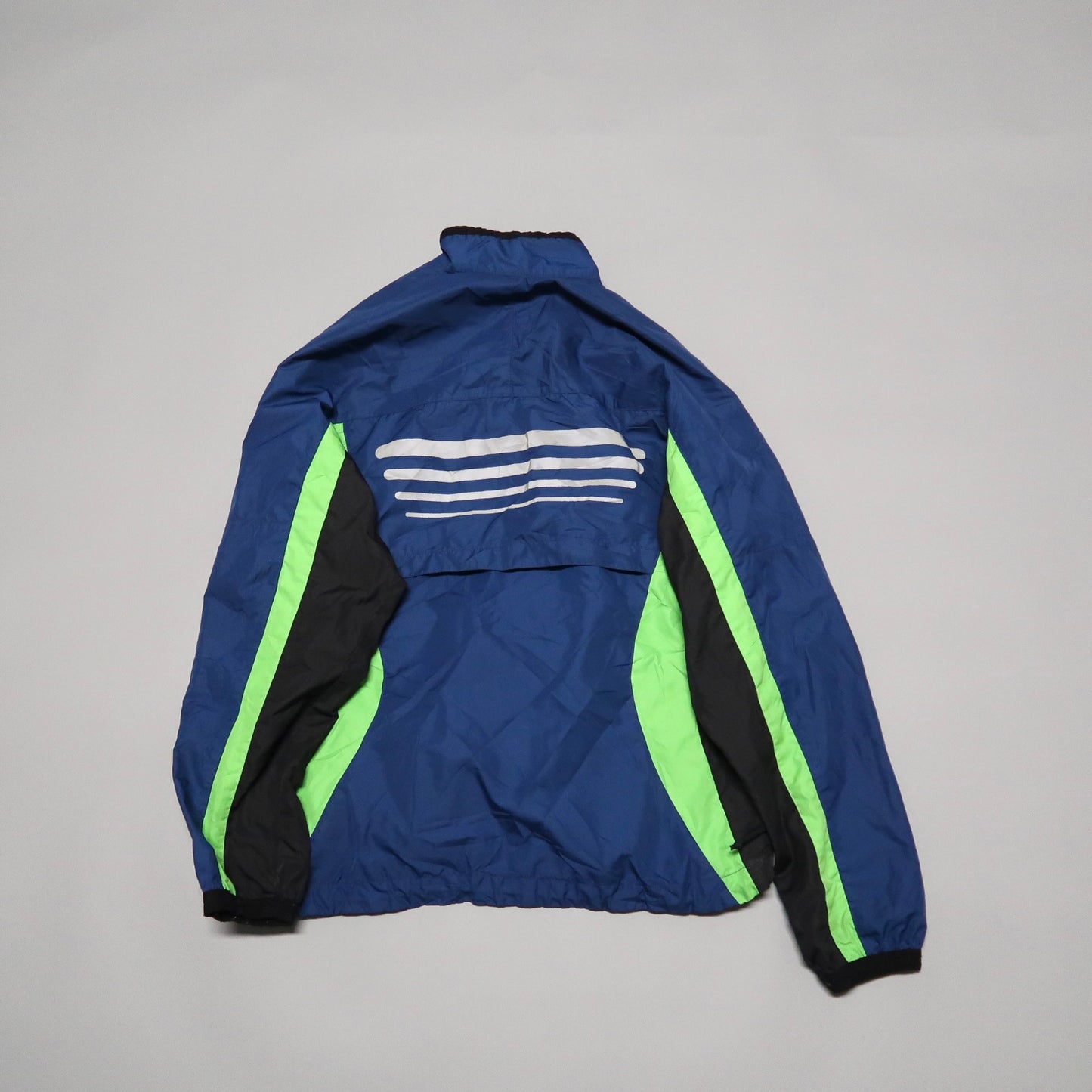Blue and green jacket with white stripes on the back.