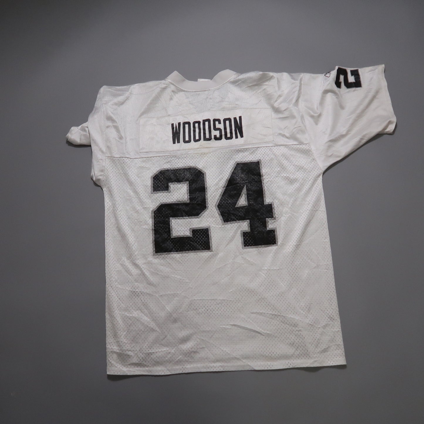 White jersey with the name nullWoodsonnull and number null24null in black.