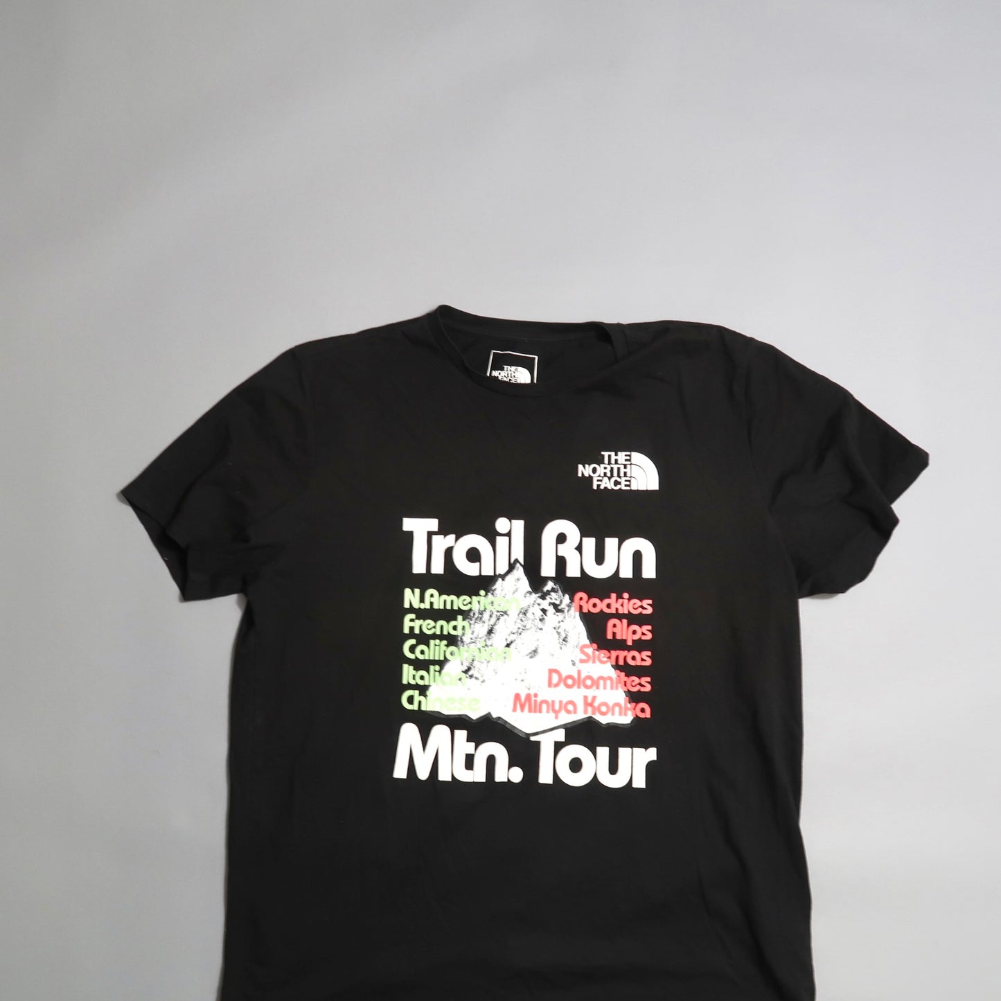 Black T-shirt with nullTrail Run Mtn. Tournull and mountain names design.
