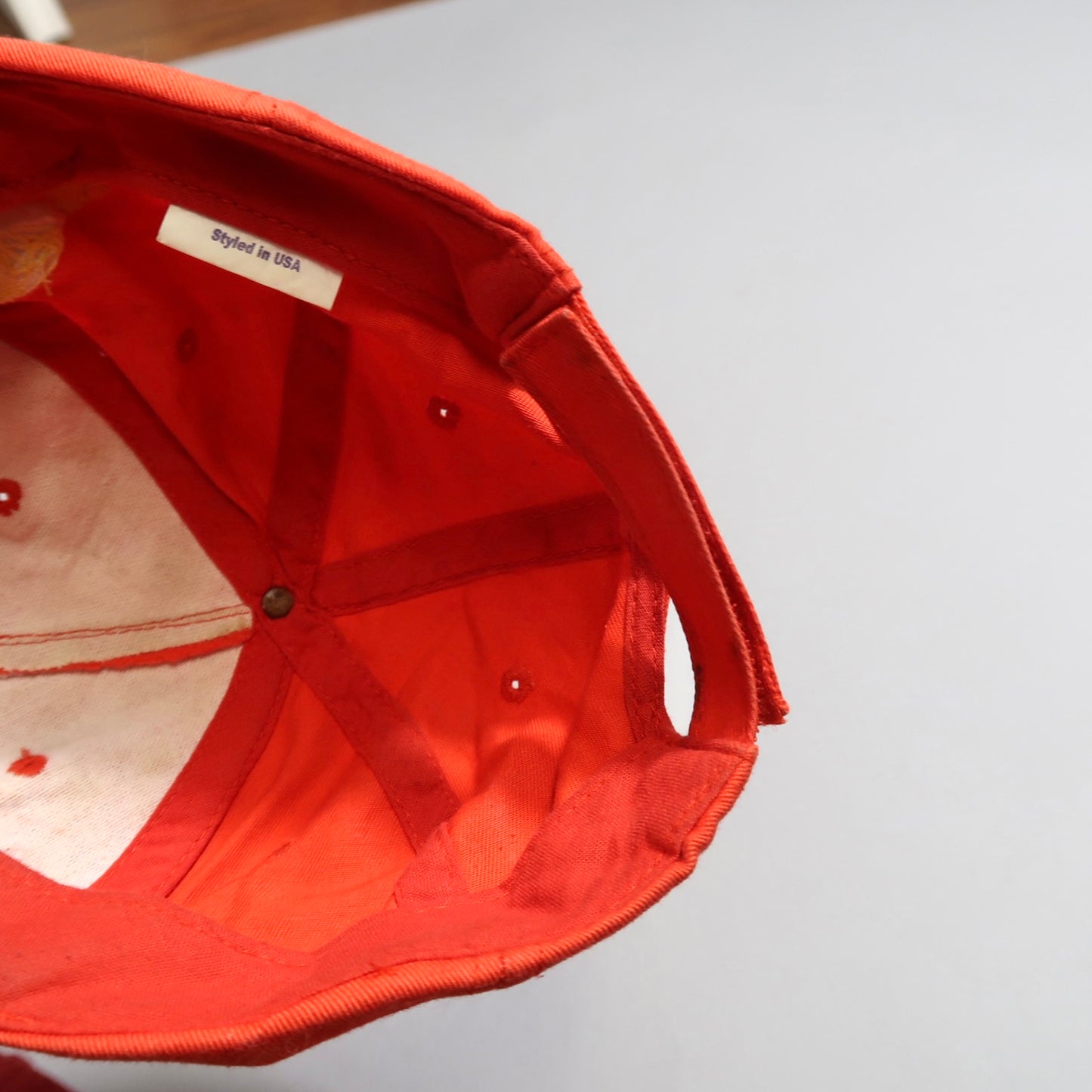 Inside view of a red cap with nullStyled in USAnull tag.