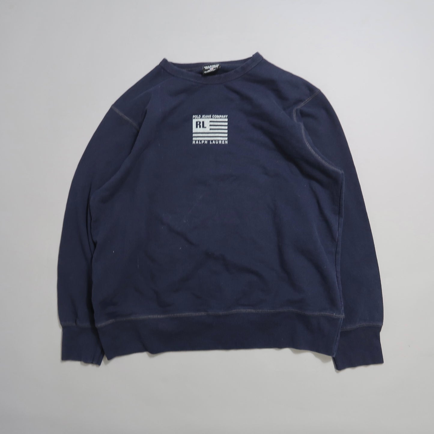 Navy sweatshirt with nullRLnull logo and American flag design on the chest.