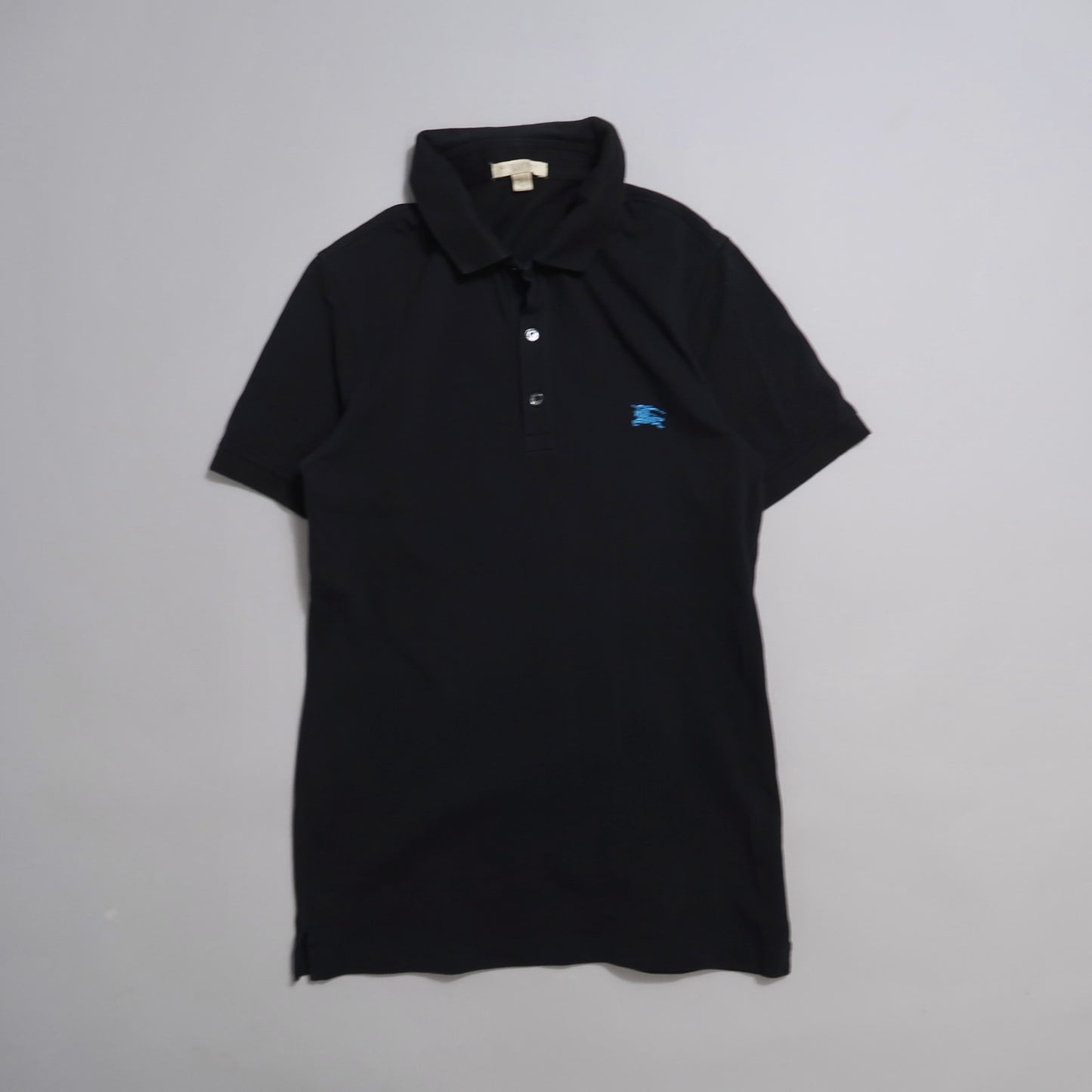 Black polo shirt with a blue embroidered logo on the chest.