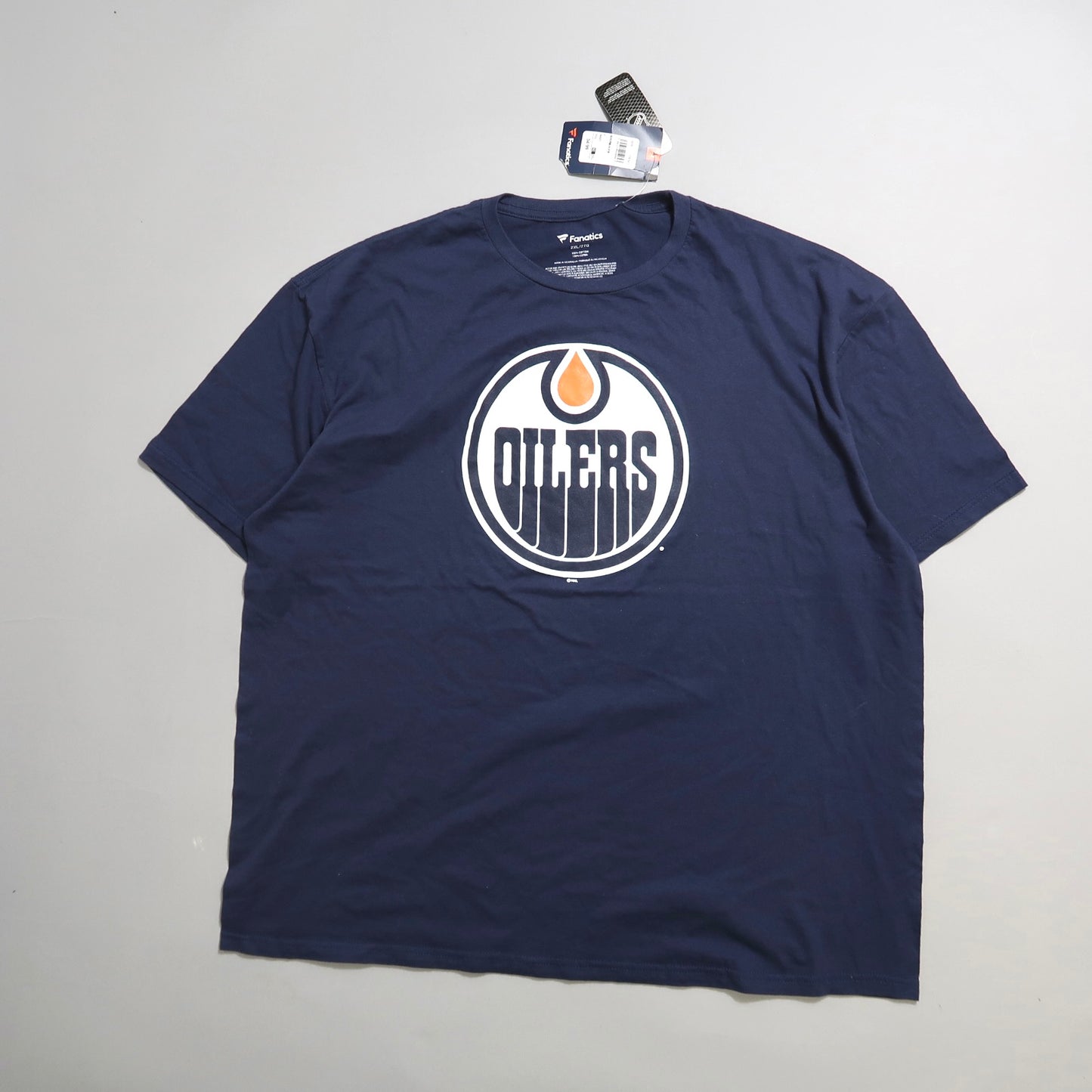 Navy blue t-shirt featuring an Oilers logo with tags attached.