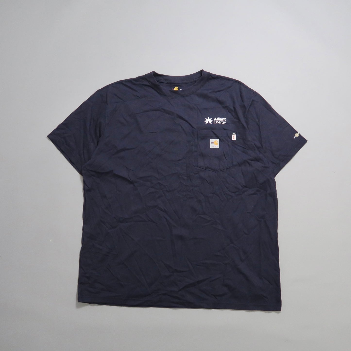 Navy blue T-shirt with a logo on the chest pocket.