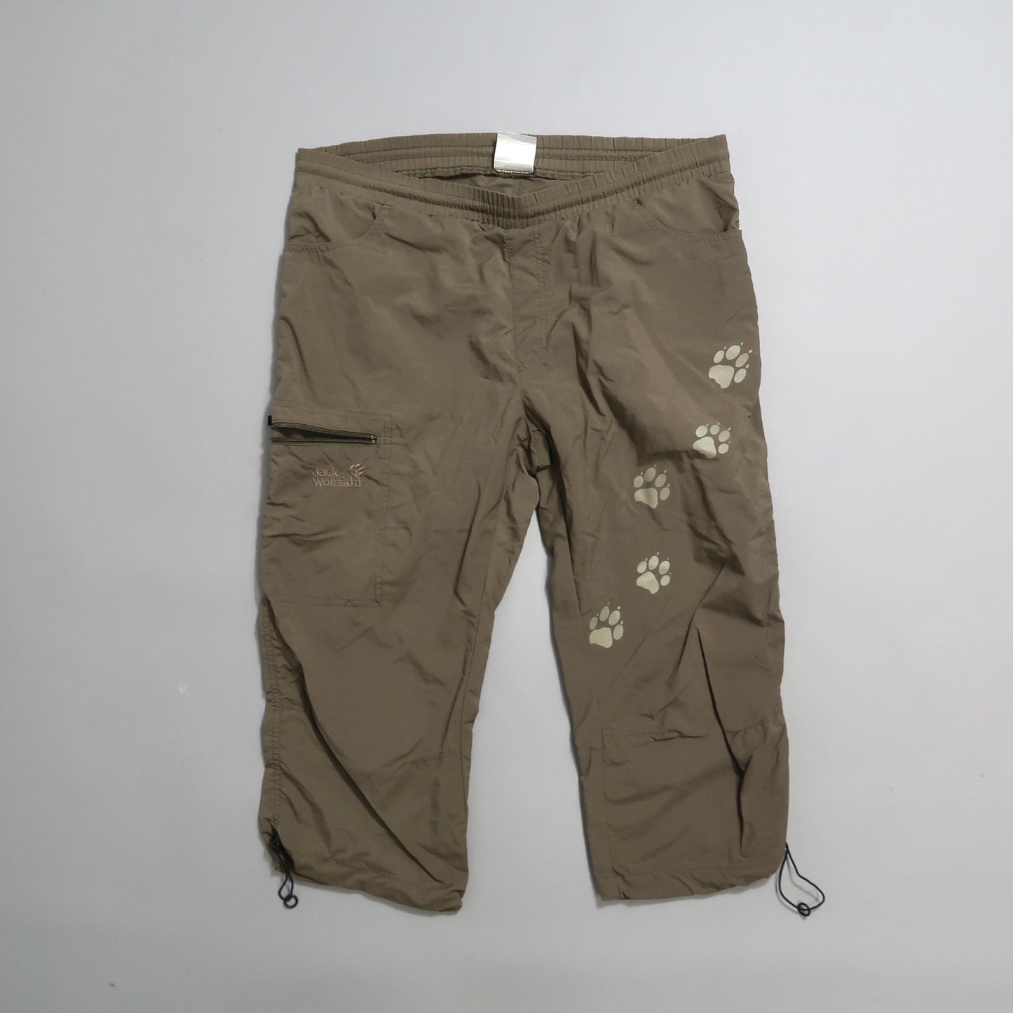 Brown cargo pants with paw print design on one leg.