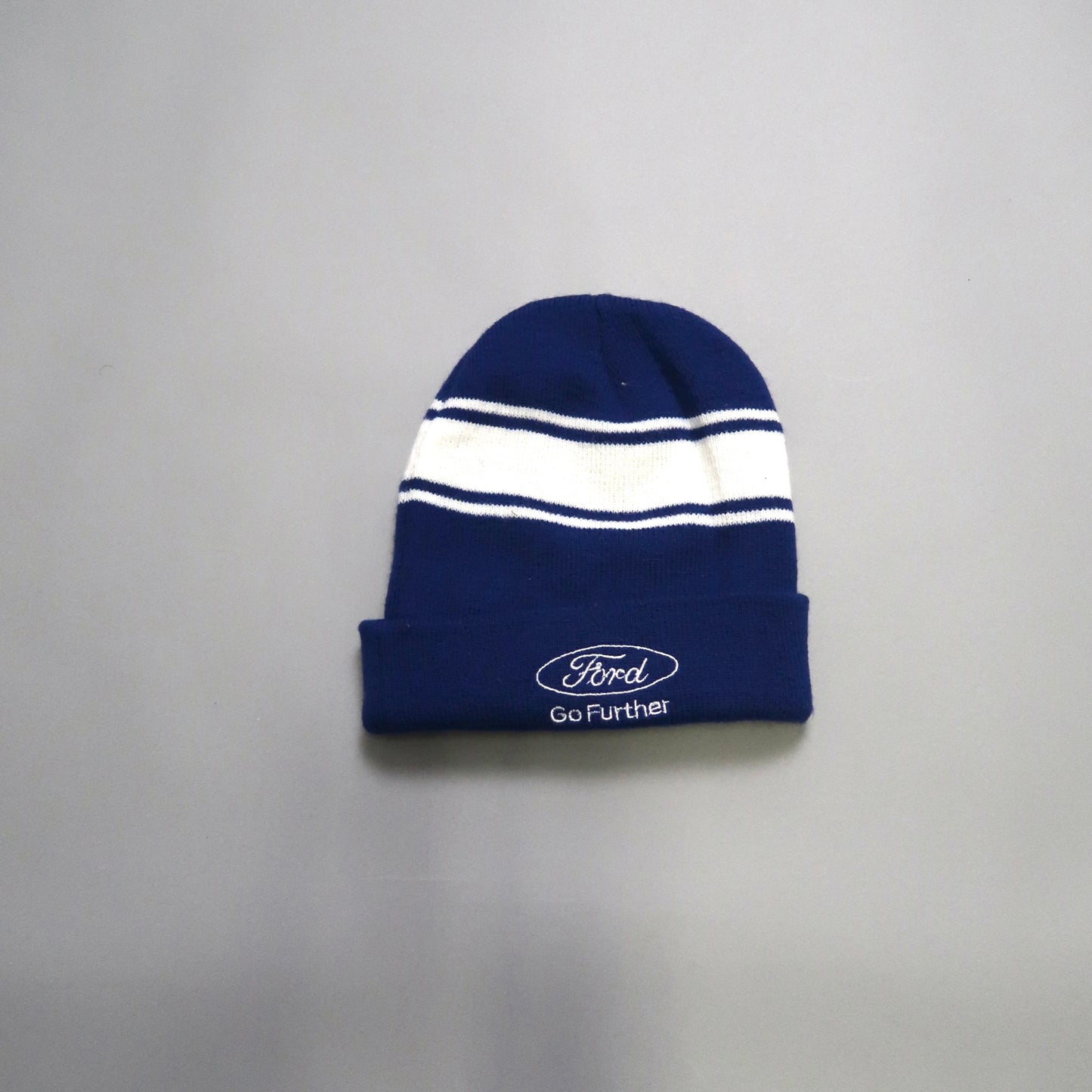Blue beanie with white stripes and Ford logo.