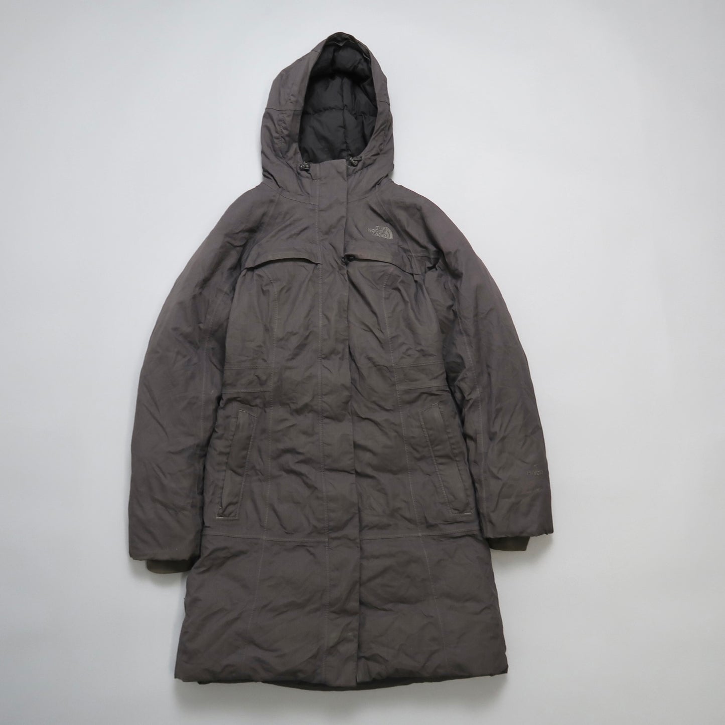 Gray hooded winter coat against a neutral background.