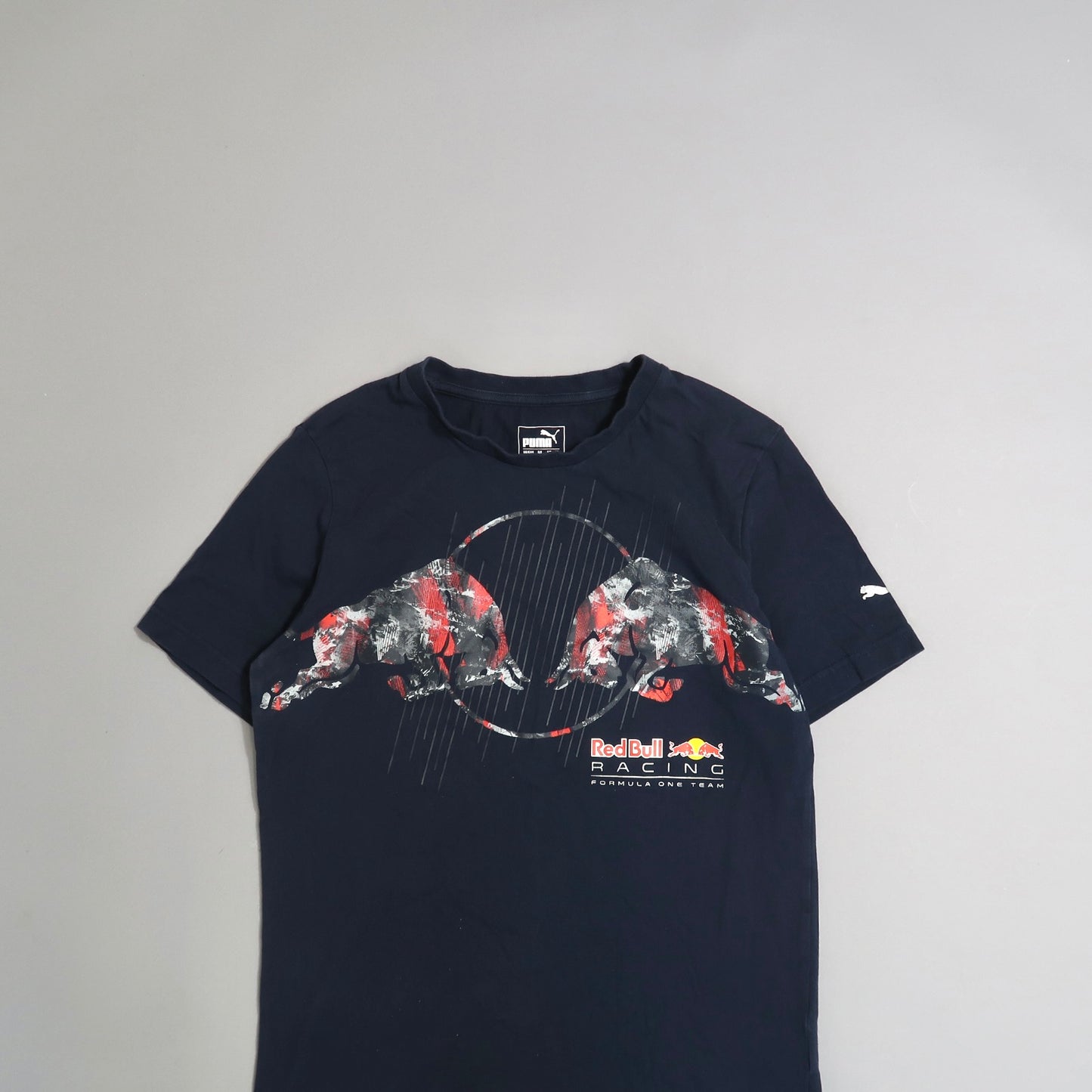 Navy T-shirt with Red Bull Racing and bull graphic design.