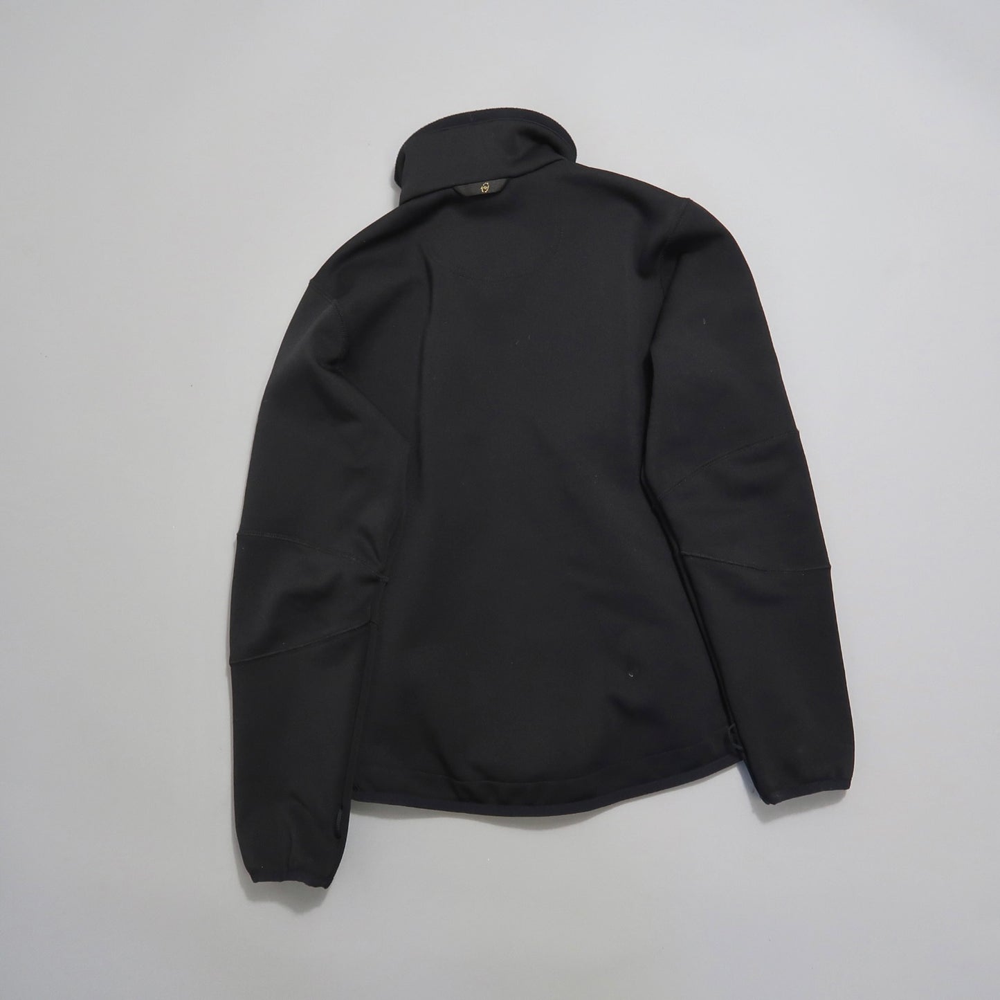 Black jacket displayed flat against a plain background.