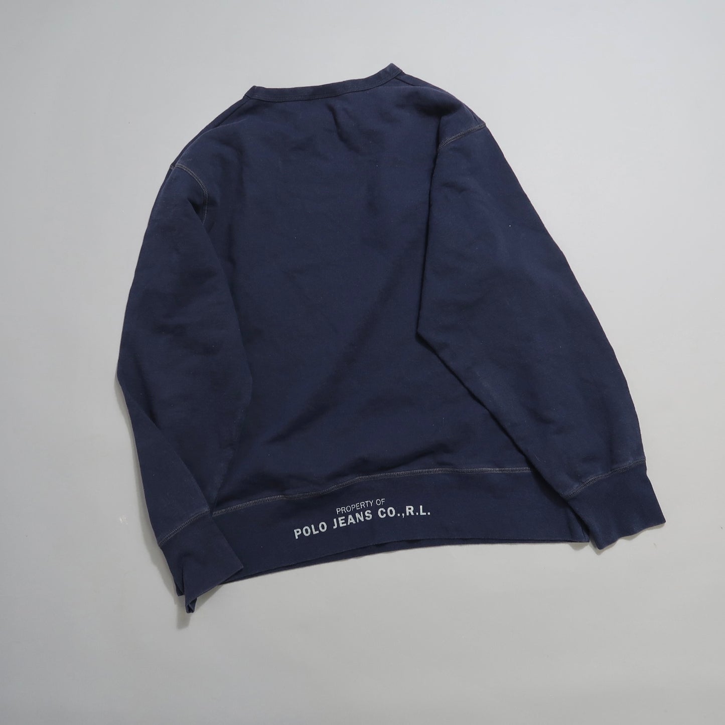 Navy blue sweatshirt with nullPolo Jeans Co. R.L.null text on back.