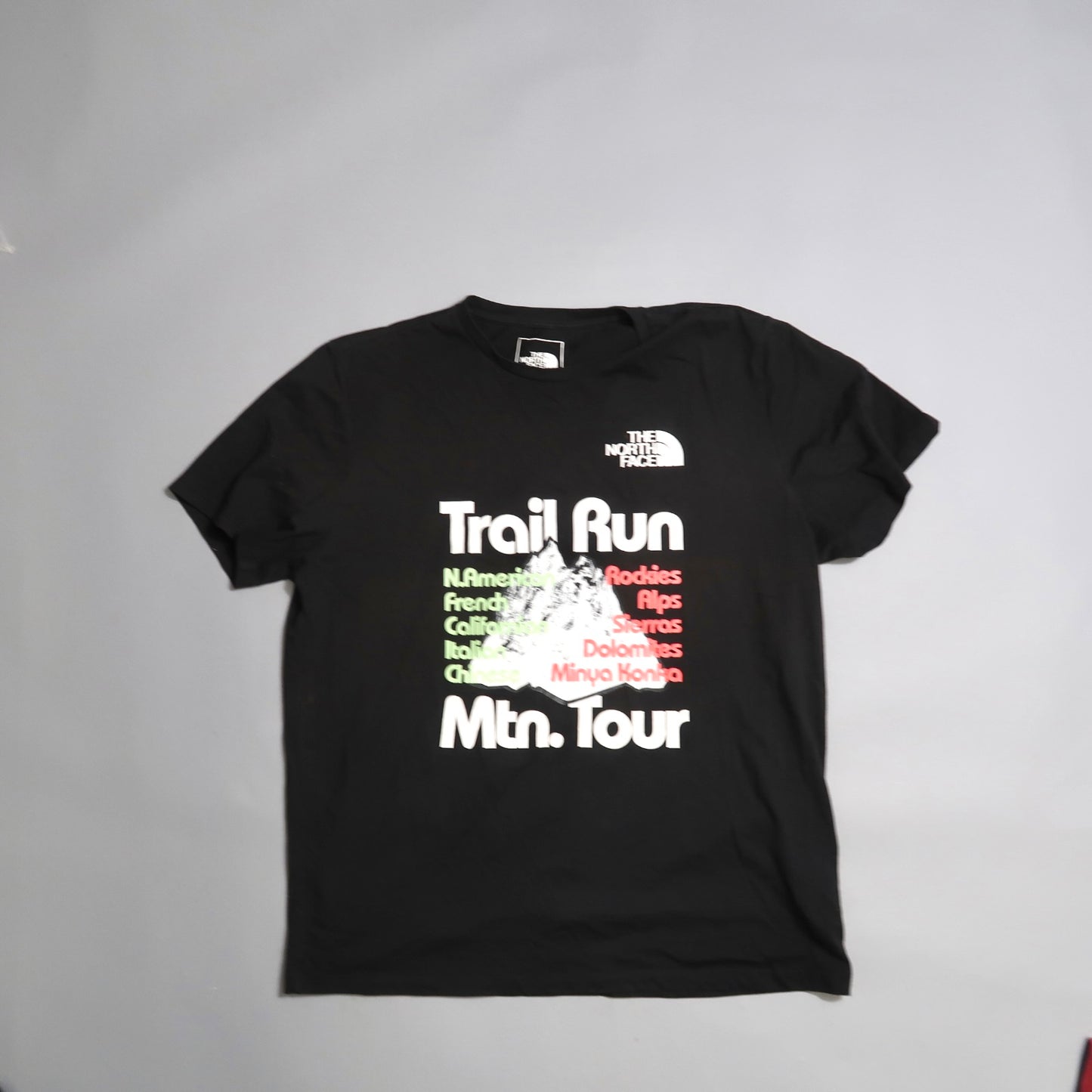 Black T-shirt with nullTrail Run Mtn. Tournull and mountains graphic.