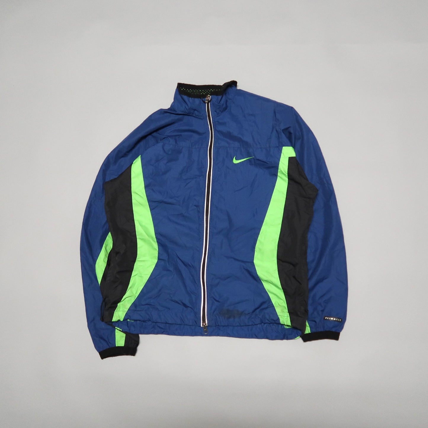 Blue and black jacket with green stripe accents on sleeves and sides.