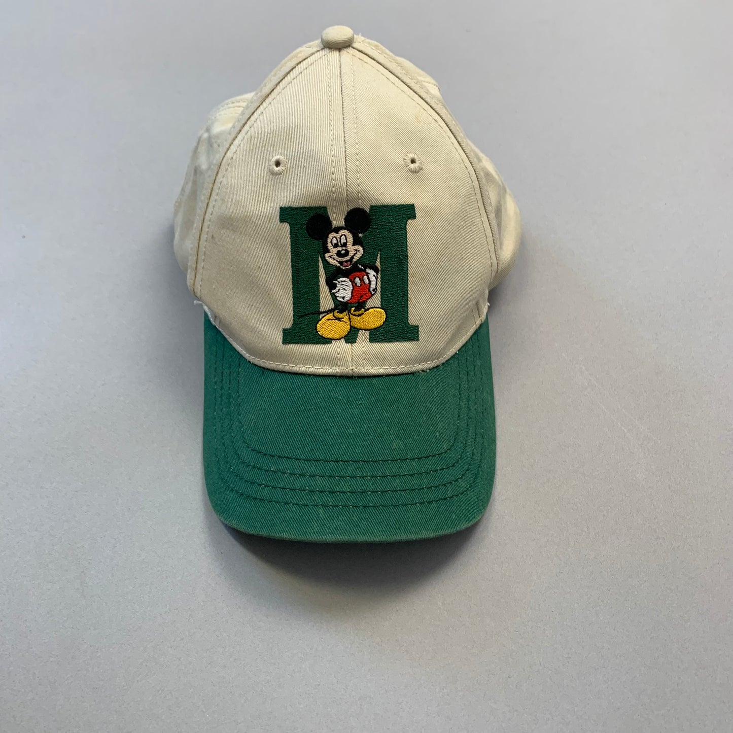 Baseball cap with Mickey Mouse and green nullMnull design.