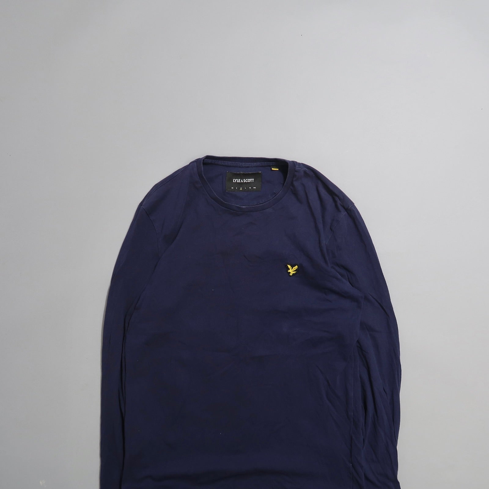 Navy blue long-sleeve shirt with yellow embroidered logo.