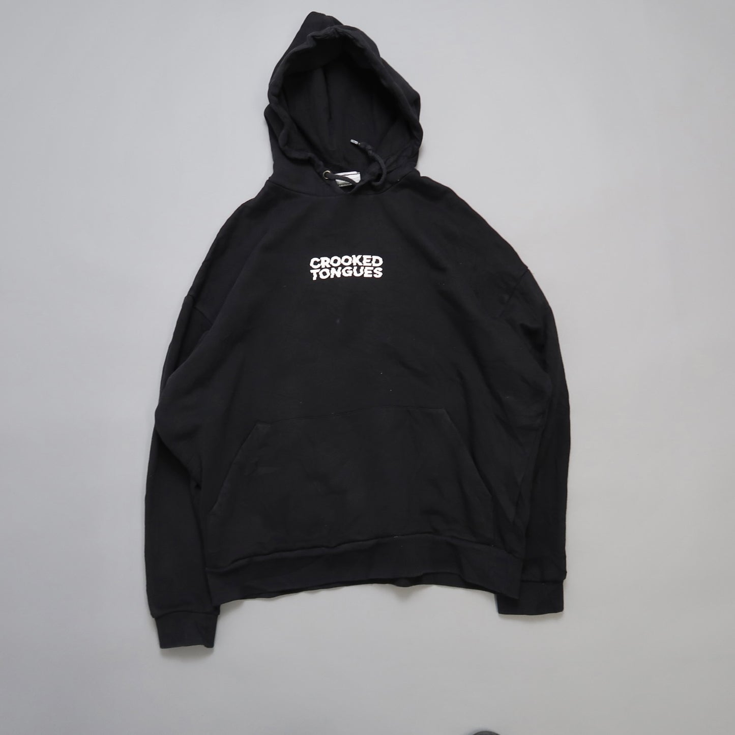 Black hoodie with nullCrooked Tonguesnull text on the front.