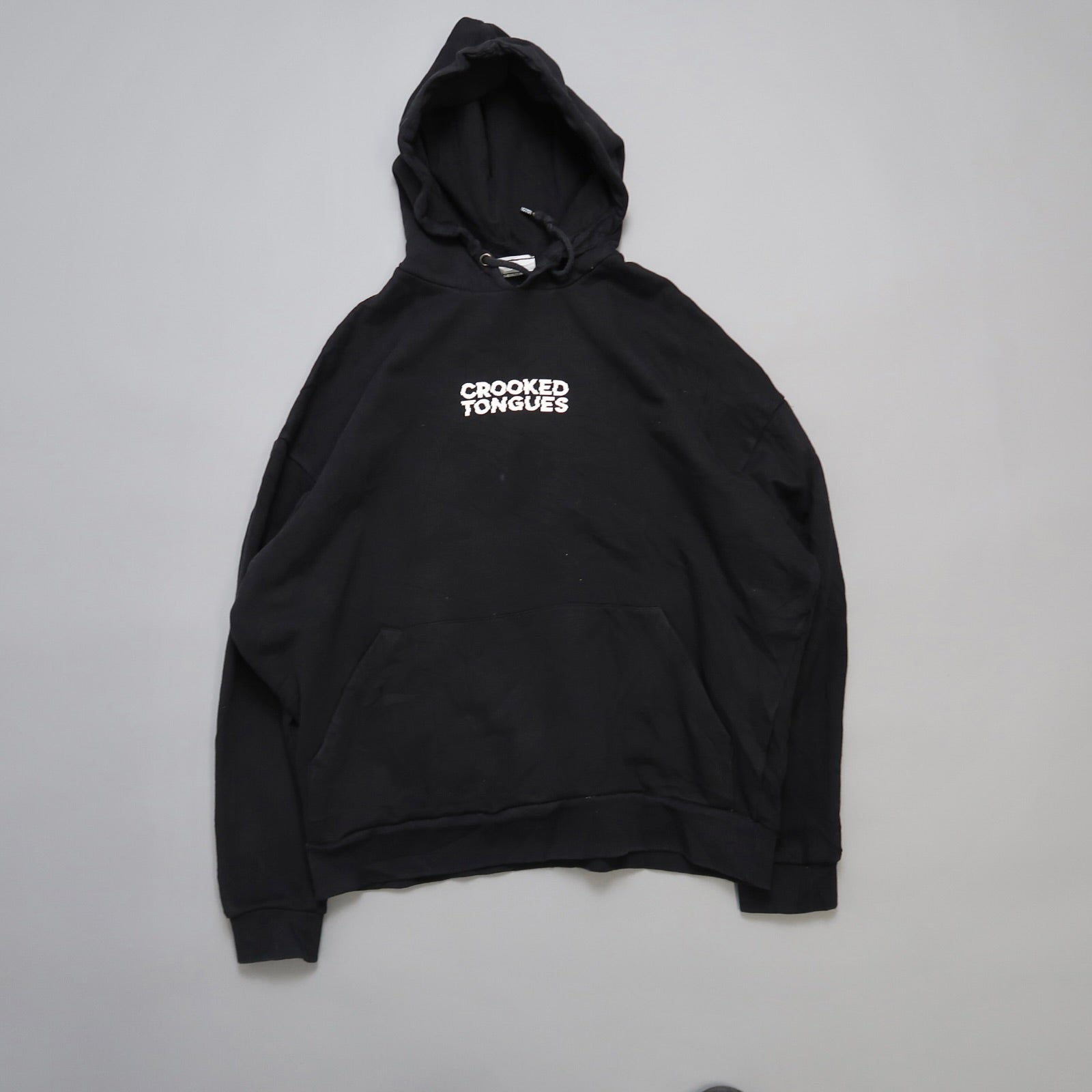 Black hoodie with nullCrooked Tonguesnull text on the front.