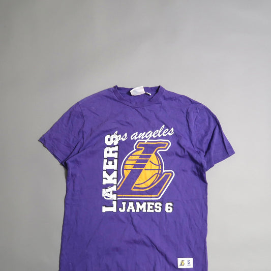 Purple Lakers T-shirt featuring nullJames 6null and team logo.