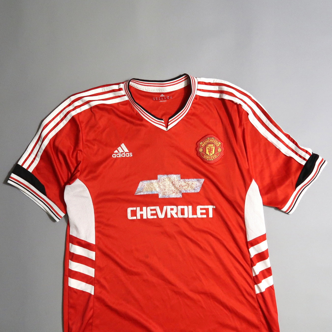 Red Manchester United jersey with Chevrolet and Adidas logos.