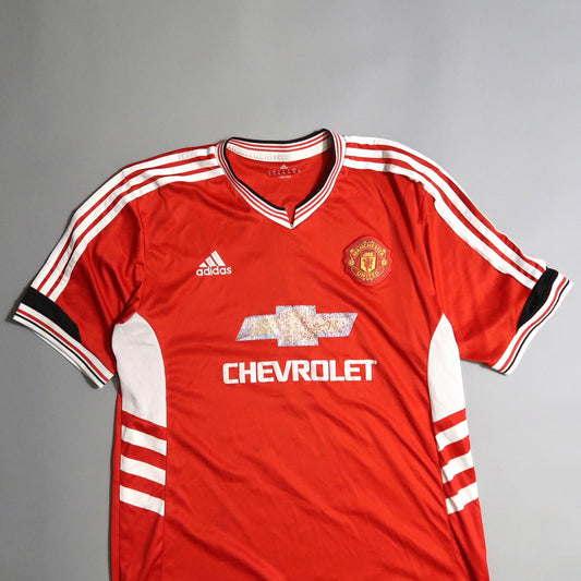 Red Manchester United jersey with Chevrolet and Adidas logos.