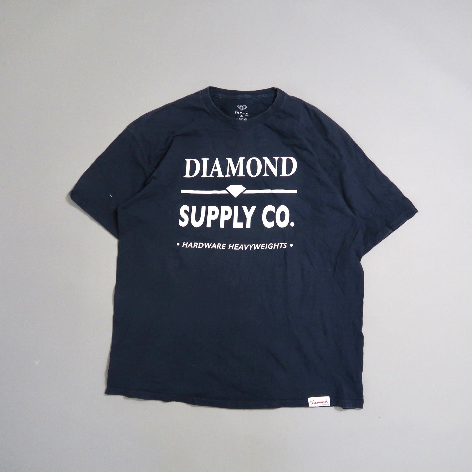 Navy blue T-shirt with nullDiamond Supply Co.null printed on the front.