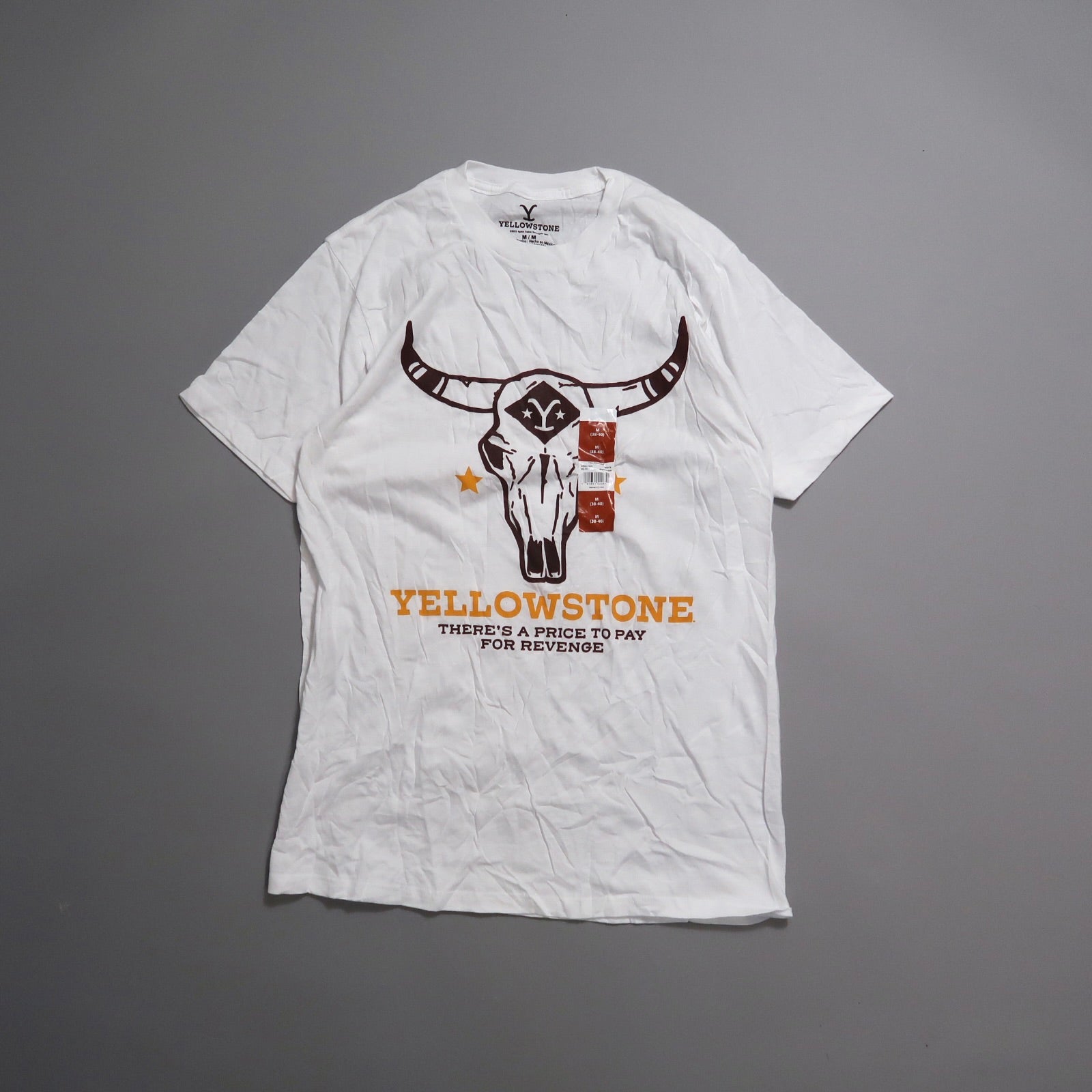 White T-shirt with nullYellowstonenull design featuring a bull skull.