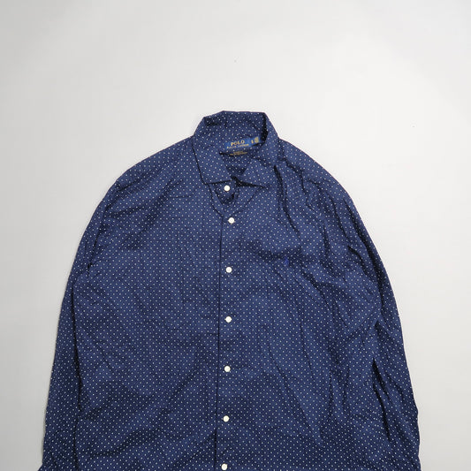 Blue and white polka dot button-up shirt on a plain background.