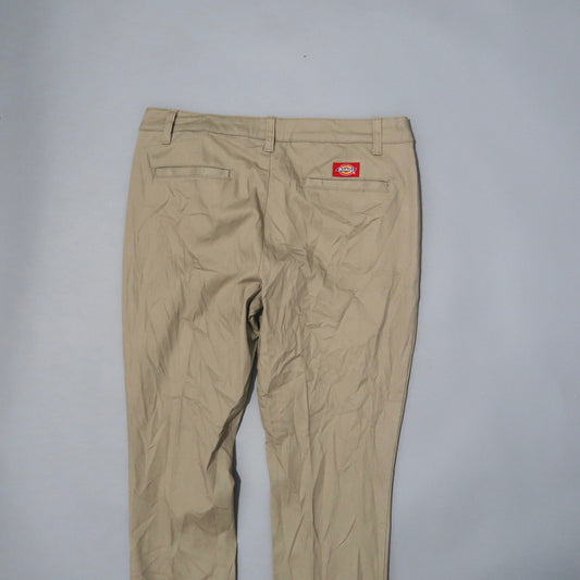 Khaki pants with back pockets and a red label on a light background.