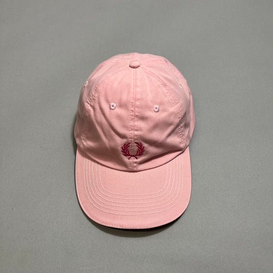Pink baseball cap with a red embroidered logo on the front.