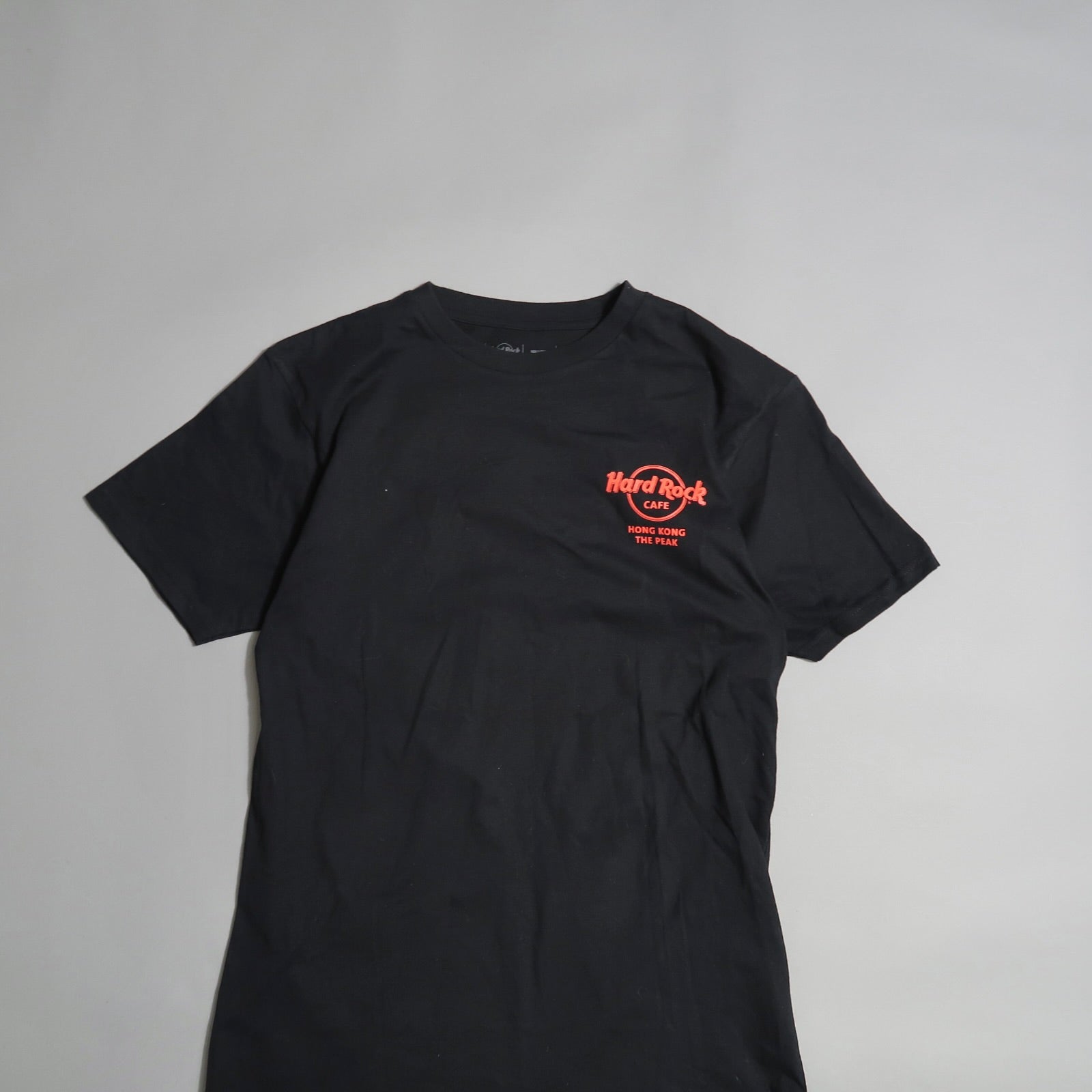 Black T-shirt with red Hard Rock Cafe logo and text.