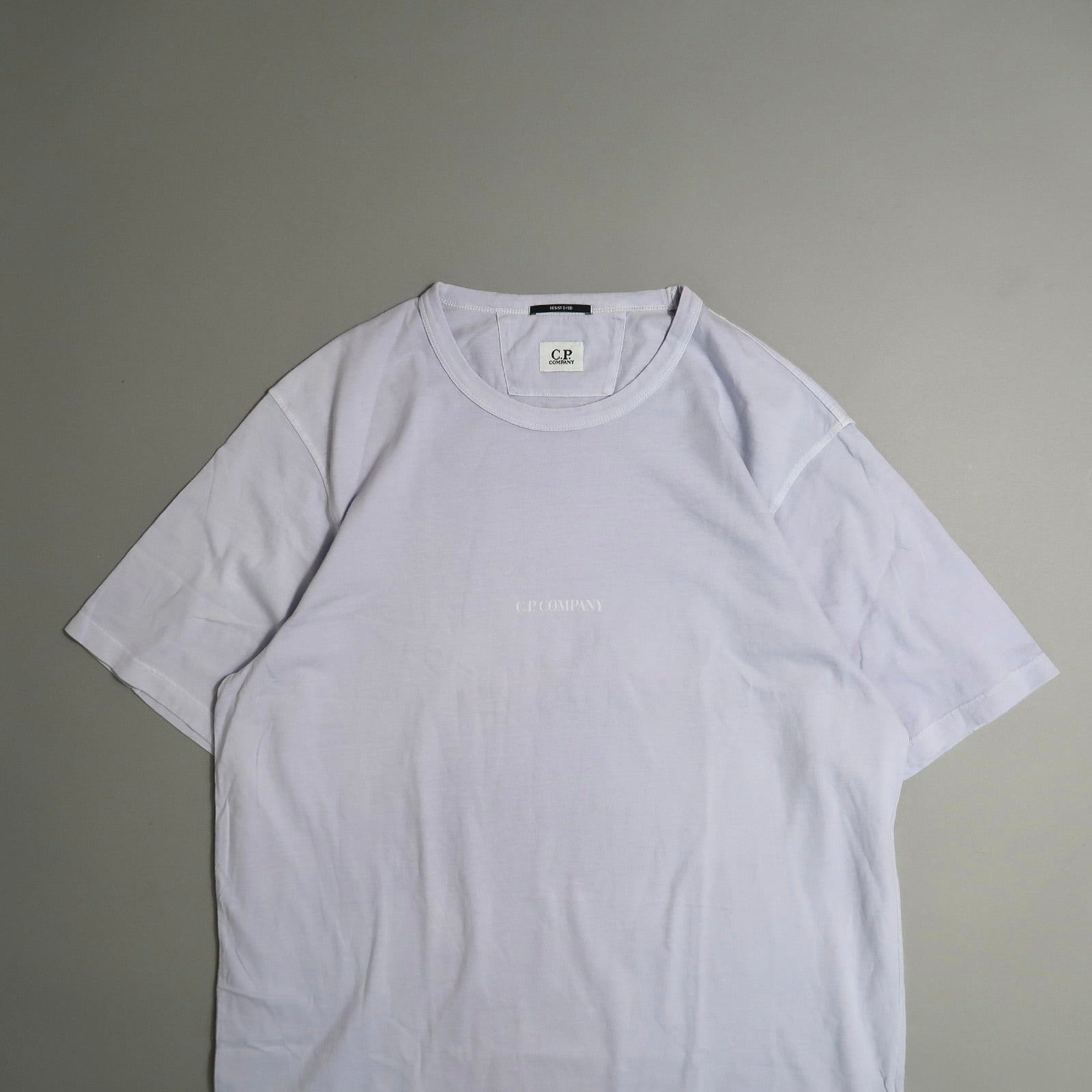 White T-shirt with nullC.P. Companynull logo on a neutral background.