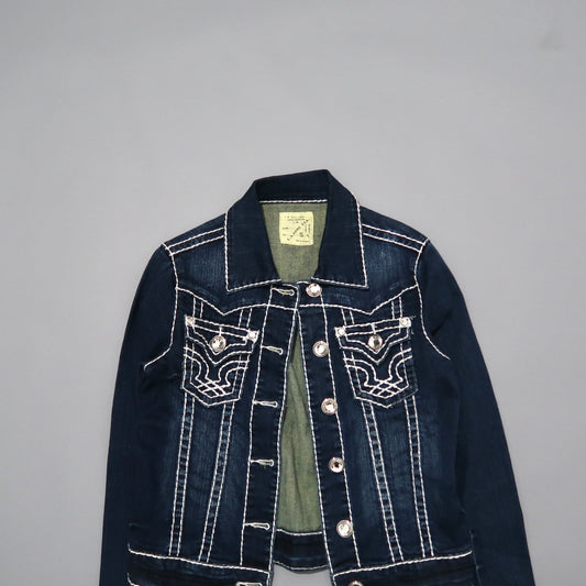 Dark denim jacket with decorative stitching, buttoned front on gray background.