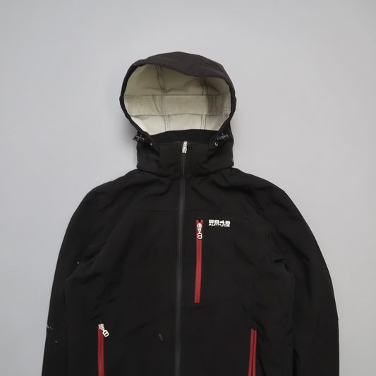 Black hooded jacket with red zippers on a light gray background.