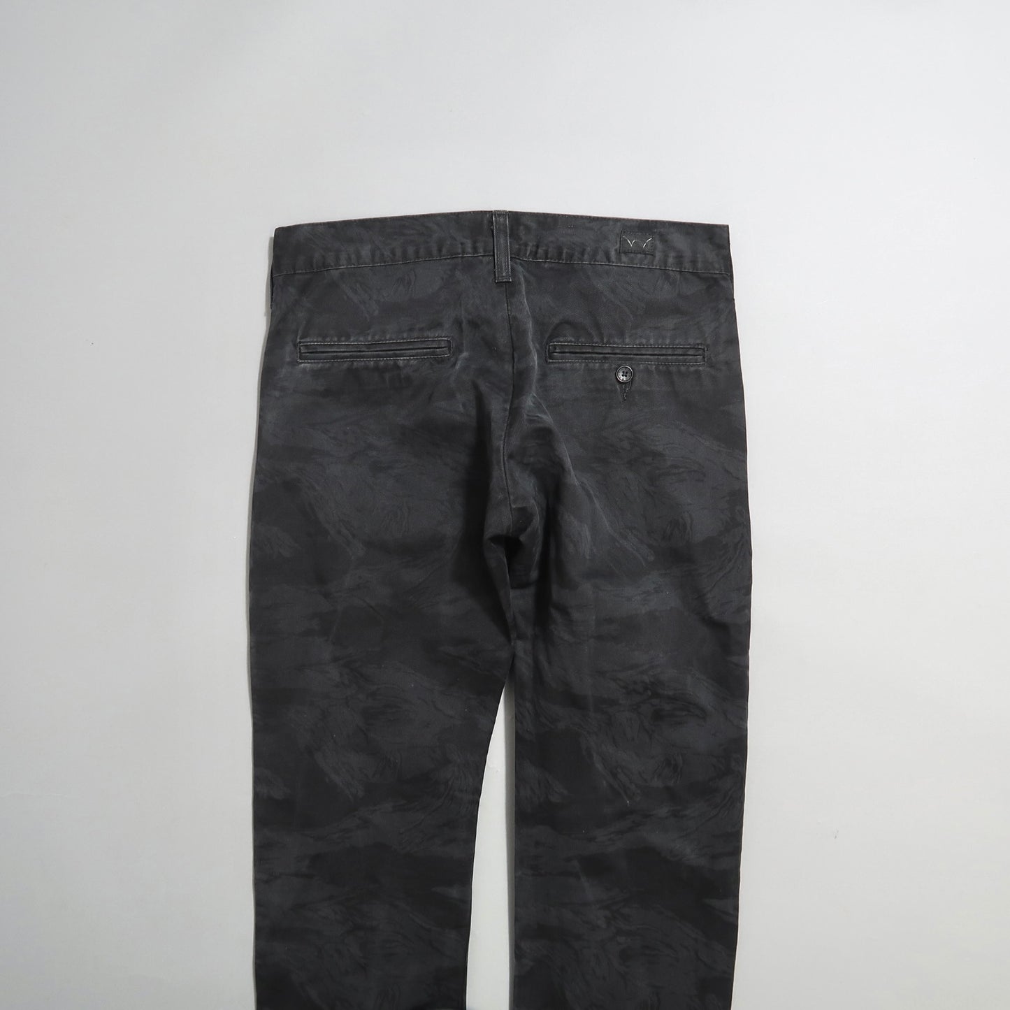Dark gray pants with back pockets displayed against a plain background.